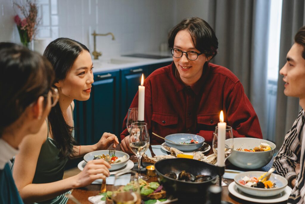 Group of happy people dining together